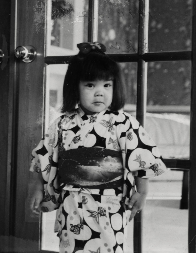 Aki, as a child, wearing a yukata